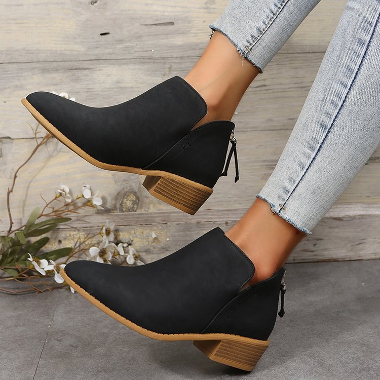 Women’s black ankle boots with pointed toe, low block heel, lace-up back zipper.
