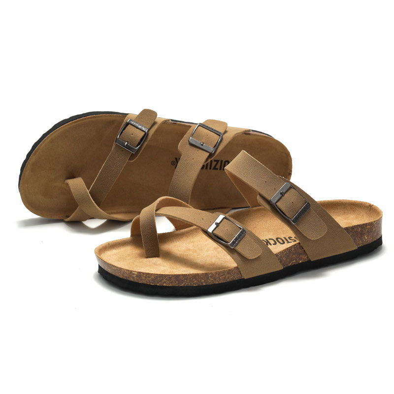 Women's cork sandals in brown, side view showing two buckle straps and cork footbed.