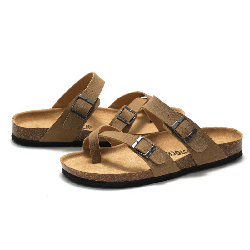Women's cork sandals in tan-brown with two adjustable buckle straps.
