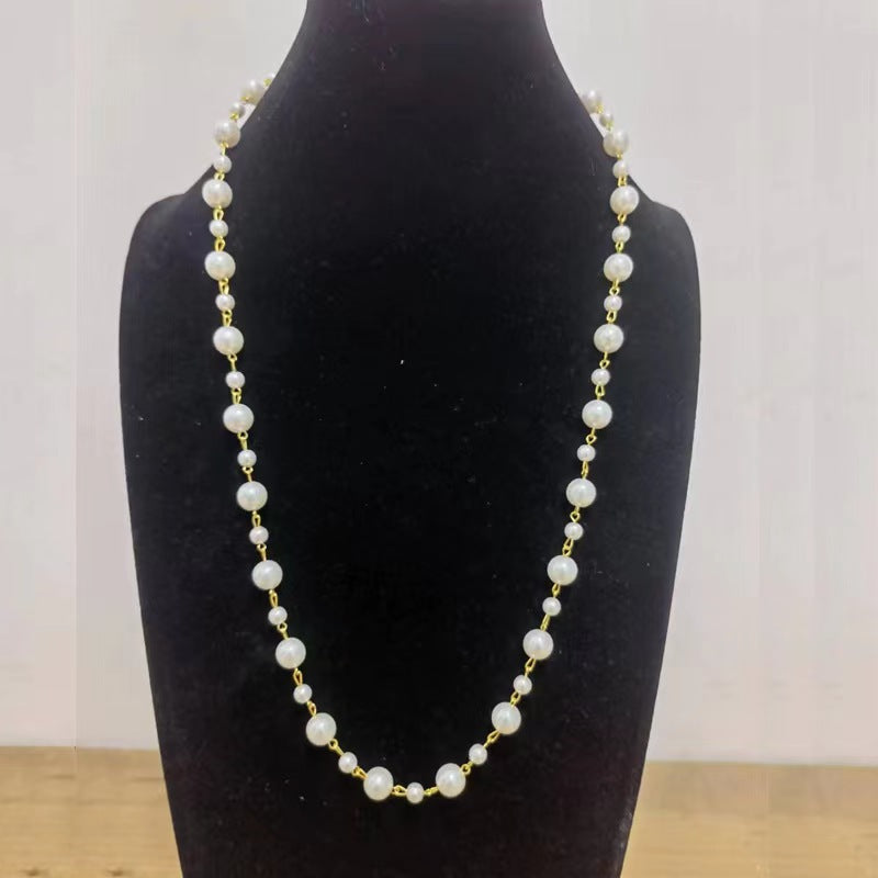 White pearl bead long chain necklace with round bead spacing