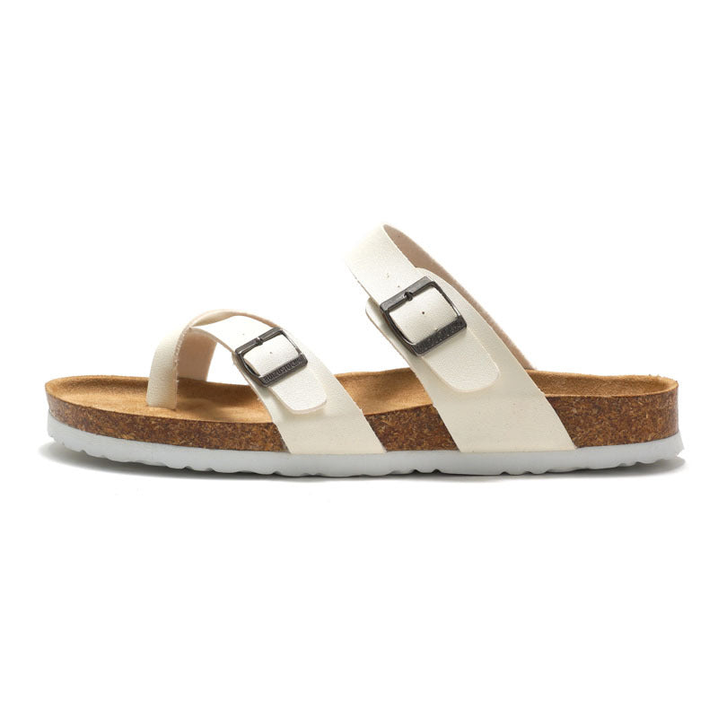 Women's cork sandals in white with two adjustable buckle straps and cork outsole.