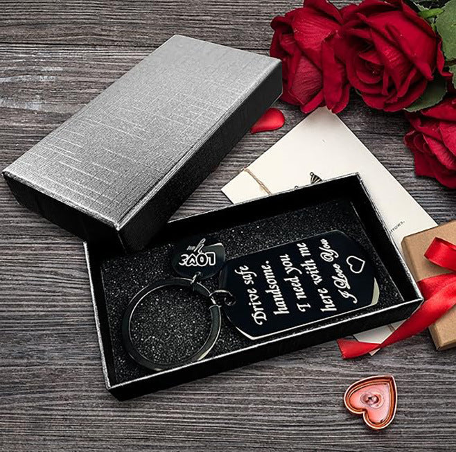 Keychain set in black gift box with ribbon, heart card, and metal key charm