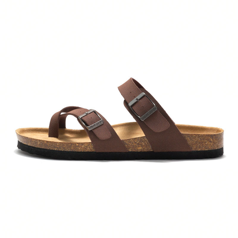 Women's cork sandals in dark brown with two adjustable buckle straps, side profile.