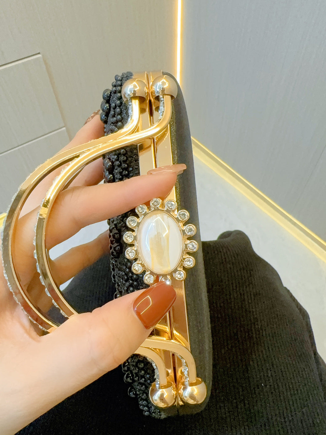 Pearl clutch clasp and handle detail with round faux-pearl accents