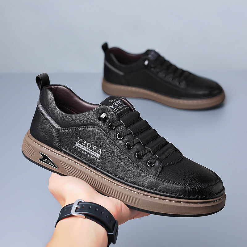Black leather lace-up flat shoes with low profile sole, front side view