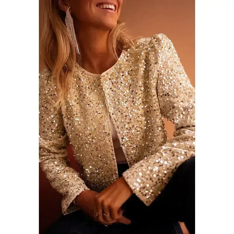 Apricot sequin jacket close-up with long puff sleeves and round neckline.