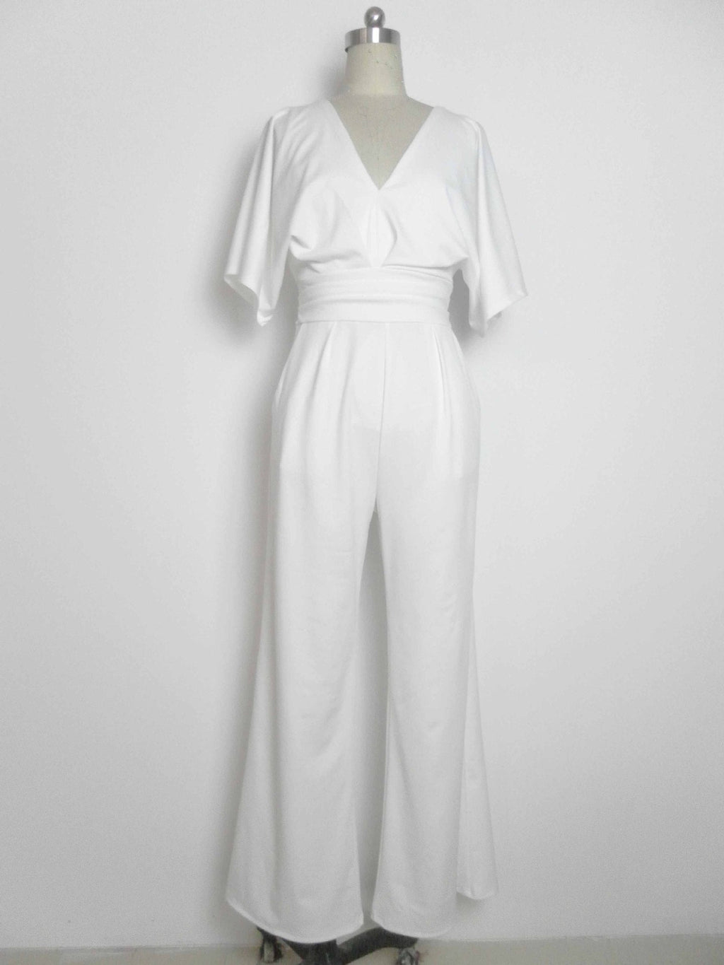 White deep V-neck wide-leg jumpsuit with belted waist and flutter sleeves