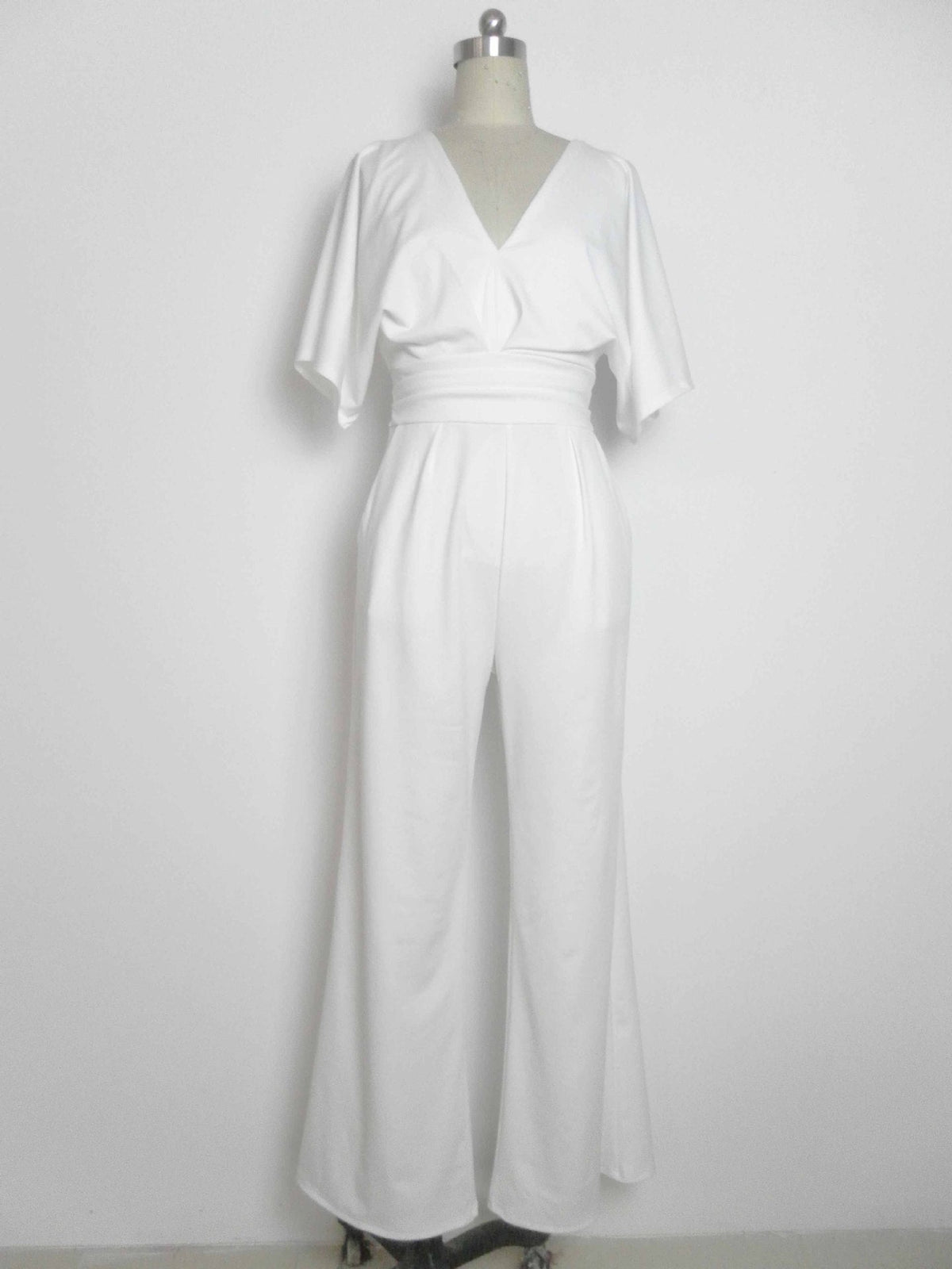 White deep V-neck wide-leg jumpsuit with belted waist and flutter sleeves