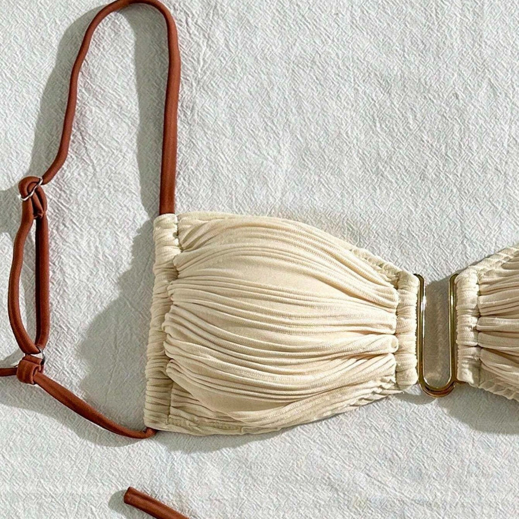 Ivory ruched bandeau bikini top close-up with brown adjustable neck strap