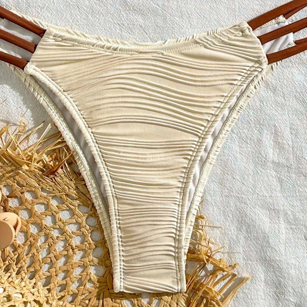 Ivory ruched high-cut bikini bottom with white edge trim and side ties