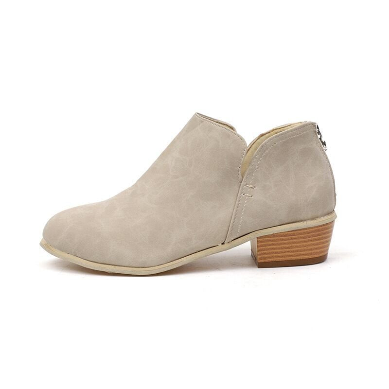 Women’s beige suede ankle boot, pointed toe, low block heel, back zipper.