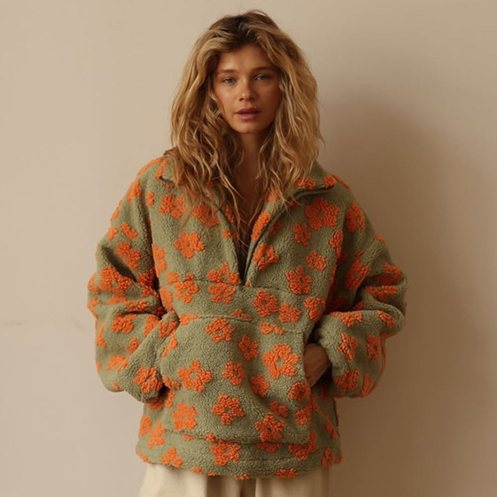 Women’s floral fleece pullover sweater in green with orange half-zip and long sleeves
