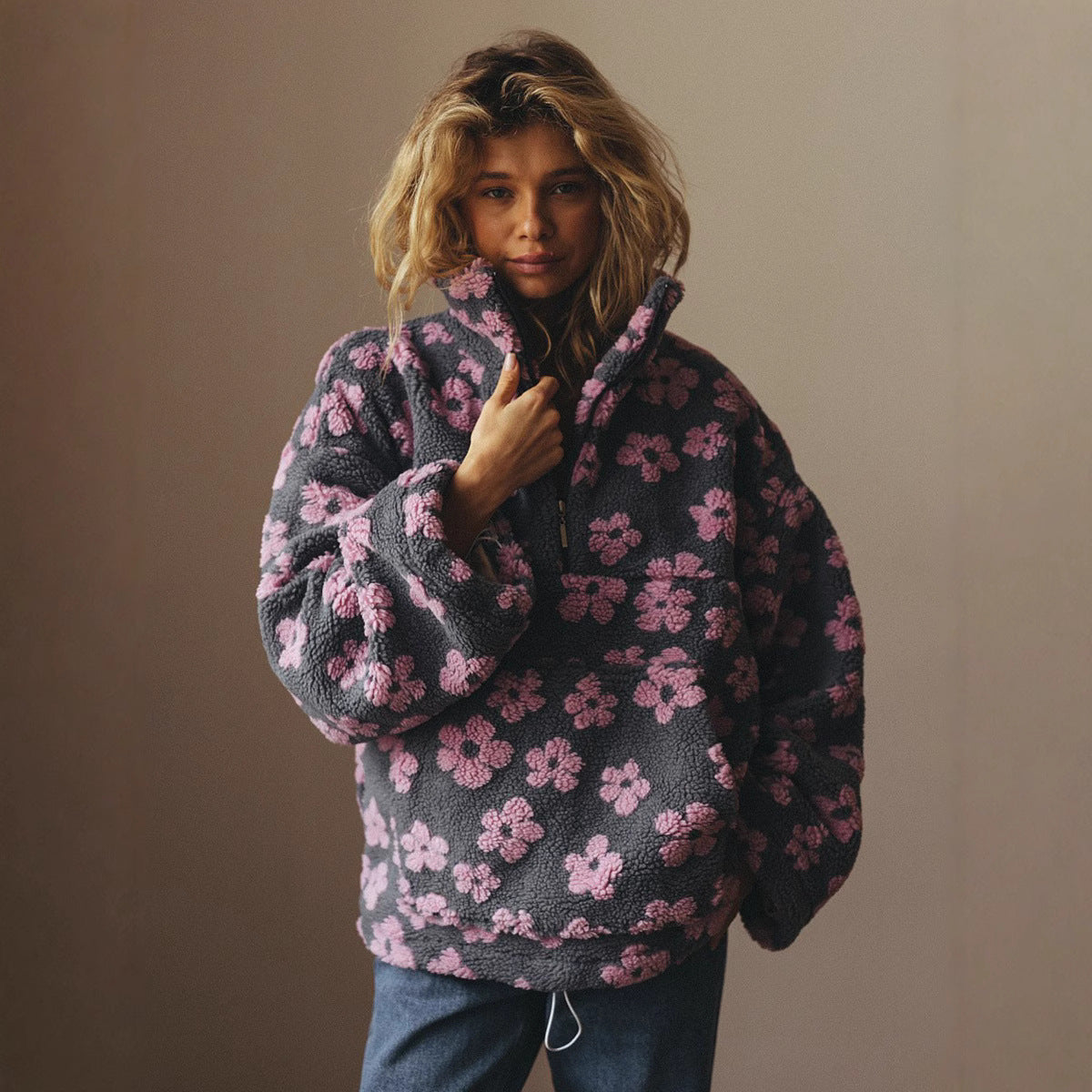 Women’s floral fleece pullover sweater in dark with pink flowers and half-zip collar