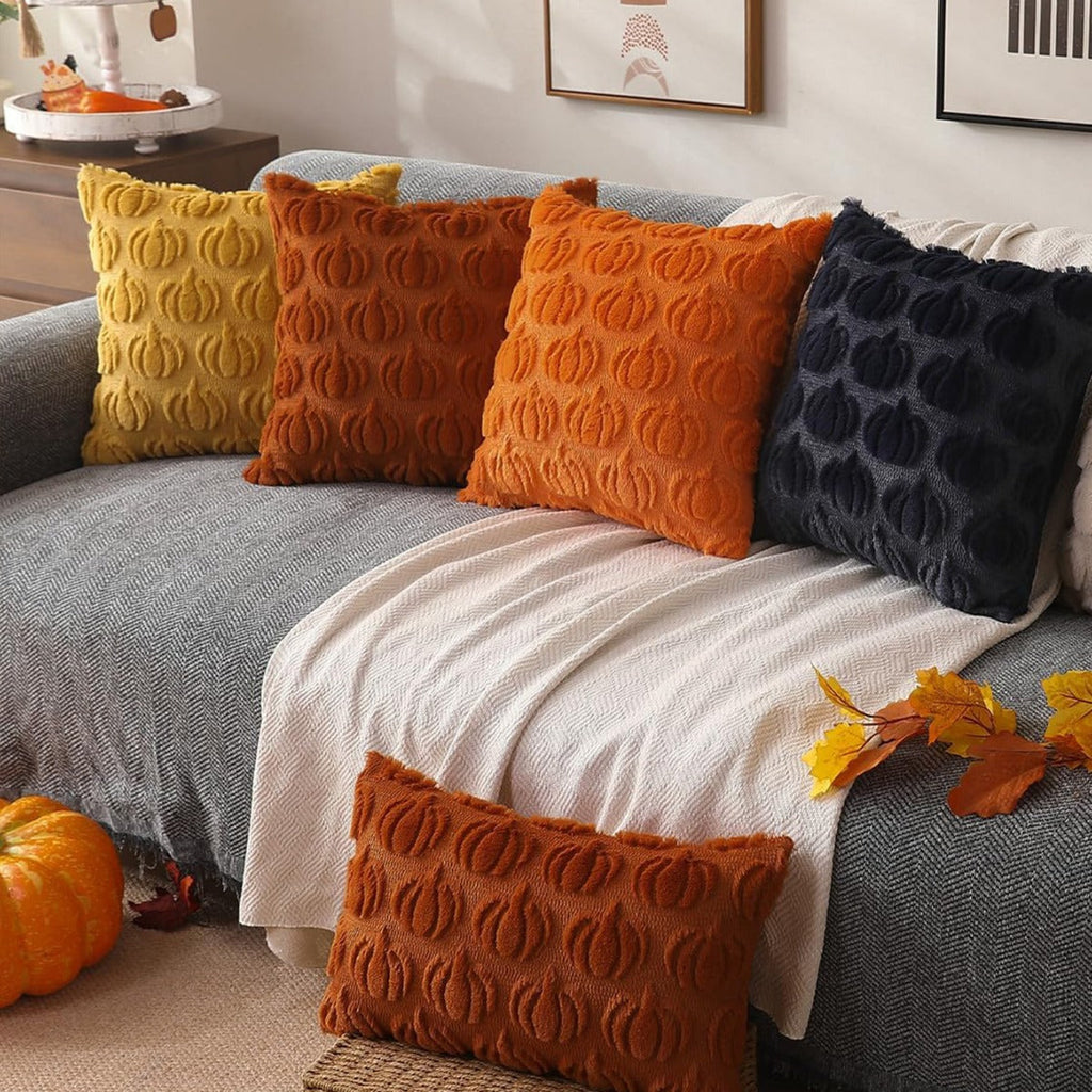 Set of 2 orange faux fur throw pillow covers with raised pumpkin pattern