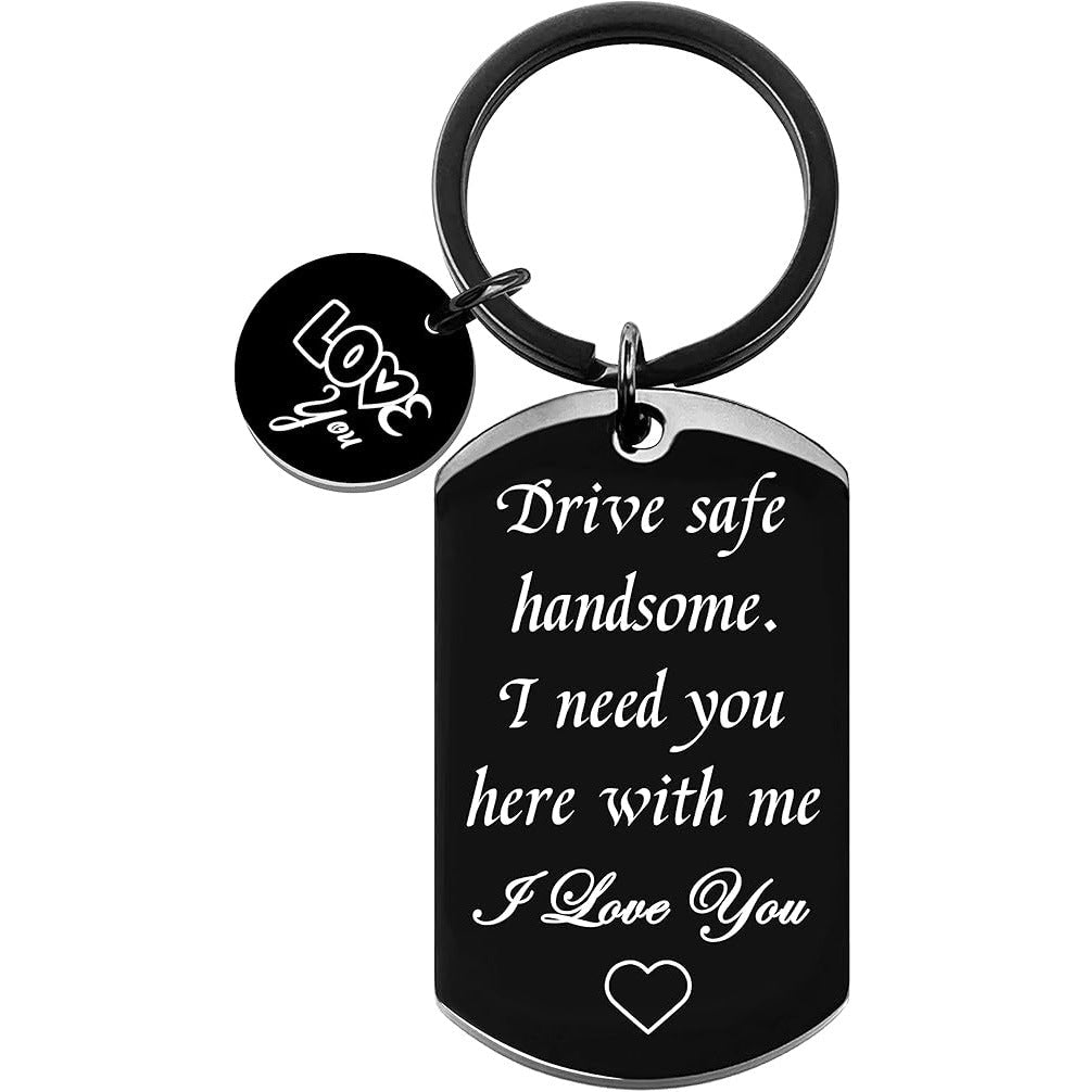 Black dog-tag keychain with metal ring, 'I Love You' heart at bottom