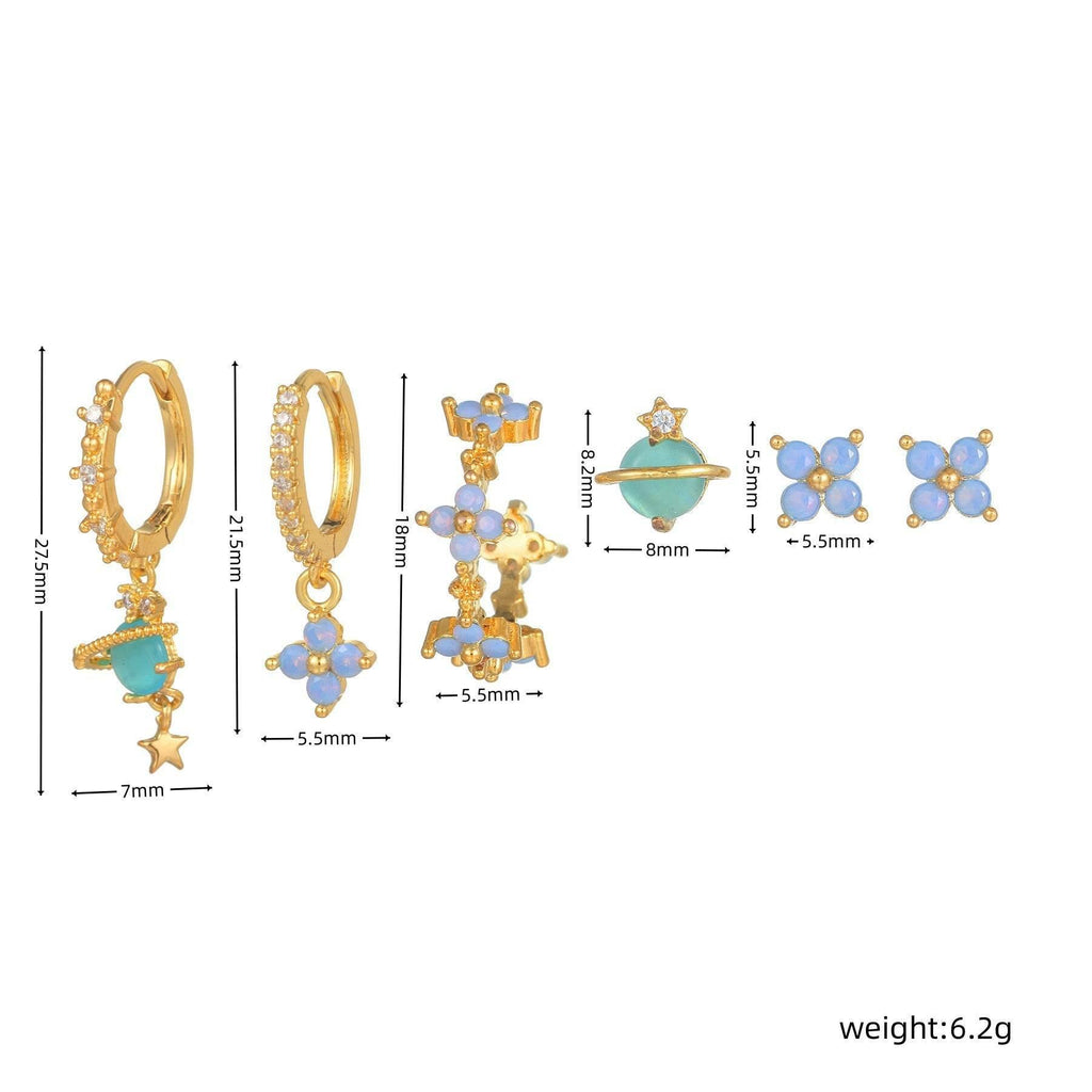Diagram of stackable earrings: gold-tone hoops, blue flowers, and teal drops