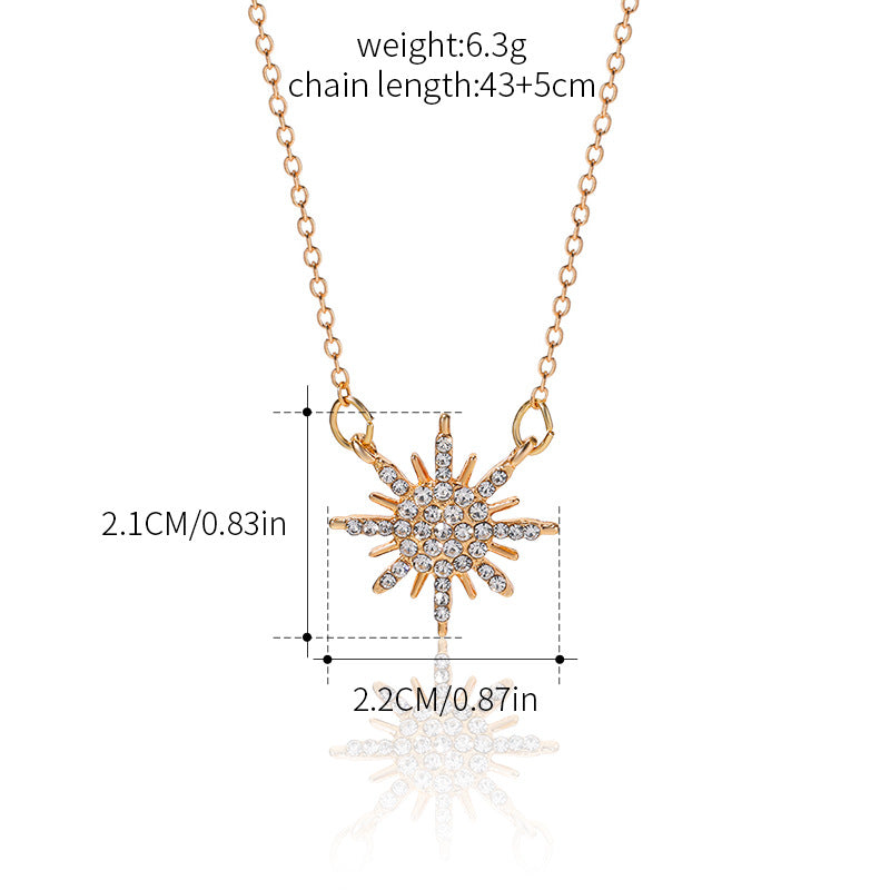 Gold-tone sunburst choker necklace; 43+5cm chain, 6.3g weight, rhinestone pendant