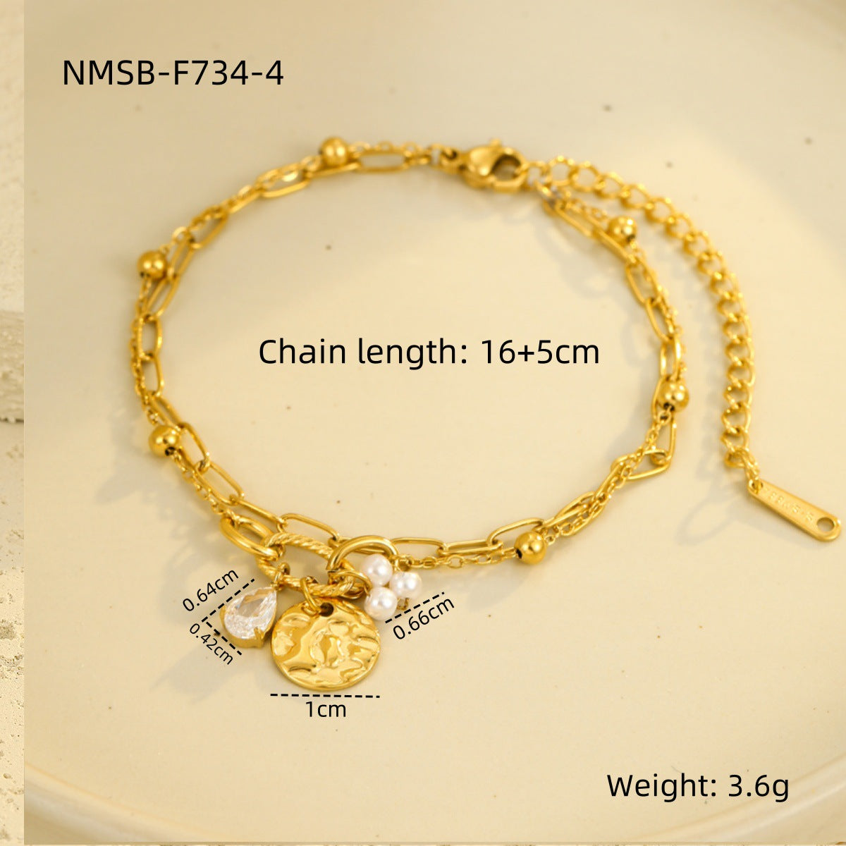 Gold-tone chain bracelet with round pearl bead and heart medallion charm