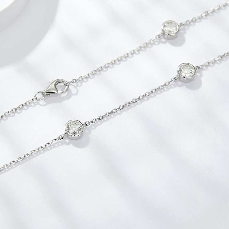 Stackable moissanite bubble bracelets with round stones on two silver-tone chains
