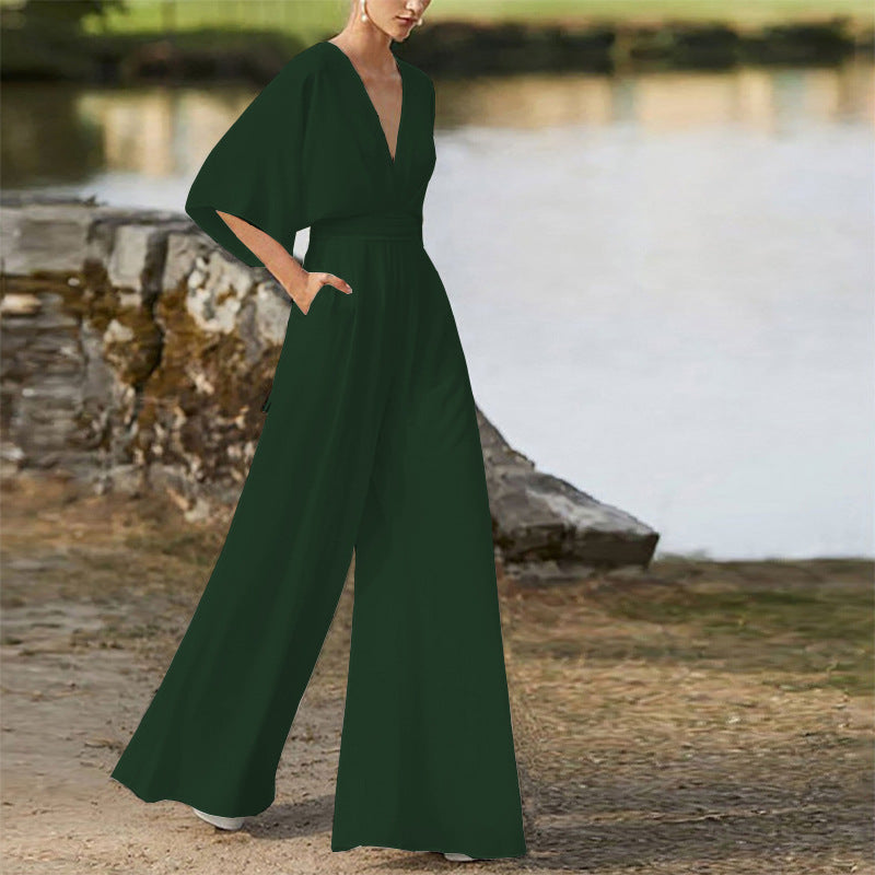 Dark green wide-leg jumpsuit dress with deep V neckline, high waist, dolman sleeves