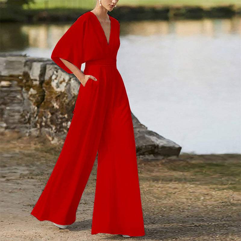 Red wide-leg jumpsuit dress with deep V neckline, high waist, dolman sleeves
