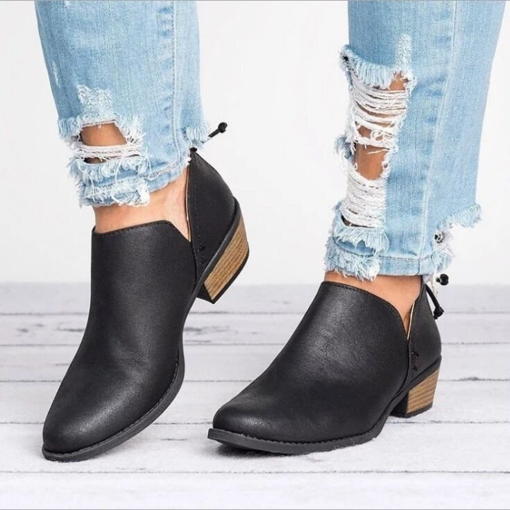 Women’s black ankle boots with pointed toe, low block heel, side back zipper detail.