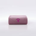 Quick-dry towel, mauve rolled with purple paw-print emblem