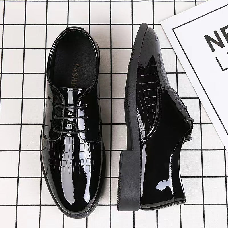Pair of black patent leather lace-up Oxford shoes with side croc texture and chunky heel