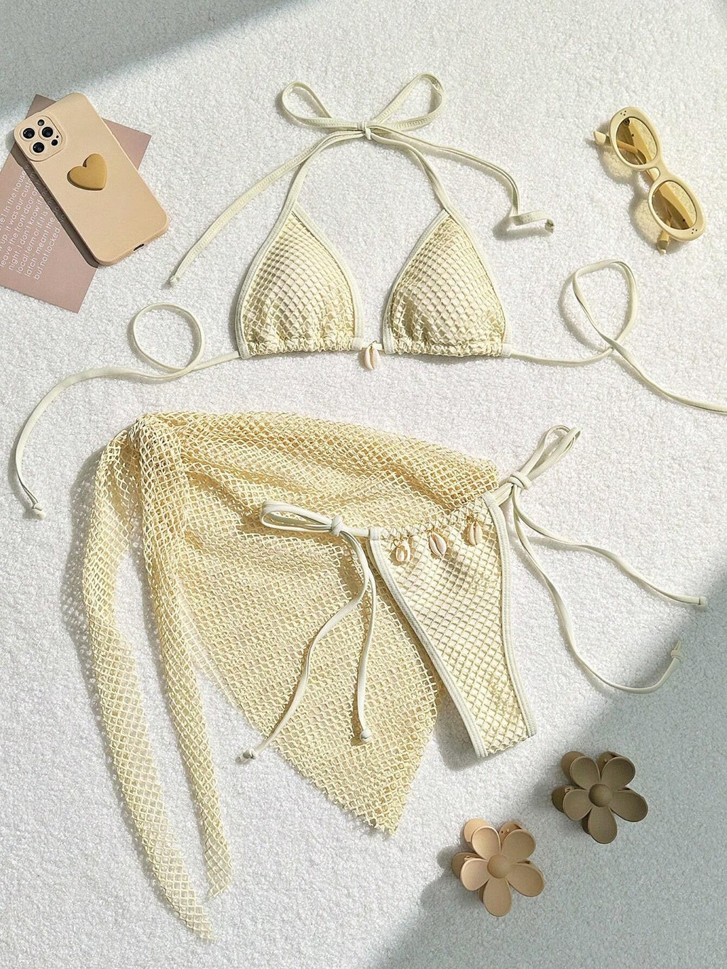 Cream three-piece split bikini set with triangle top, tie bottoms, and mesh skirt