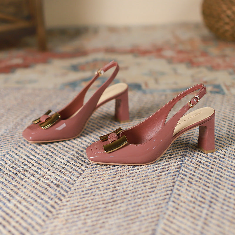Dusty pink slingback heels pair with square toe, chunky heel, and gold buckle detail