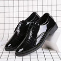 Black glossy leather lace-up Oxford shoes with crocodile-textured panels and thick sole