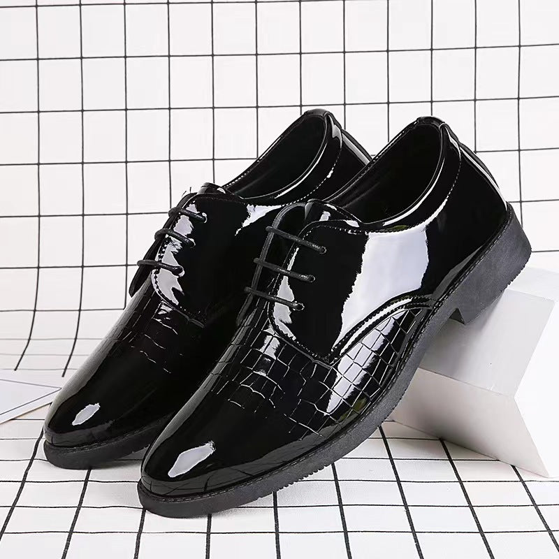 Black glossy leather lace-up Oxford shoes with crocodile-textured panels and thick sole