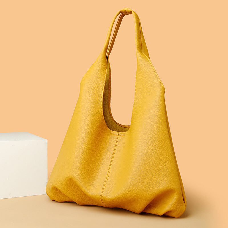Soft leather shoulder tote bag with open top and wide handles, yellow