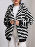 Striped plush hooded jacket in black and white, zip front, side pockets