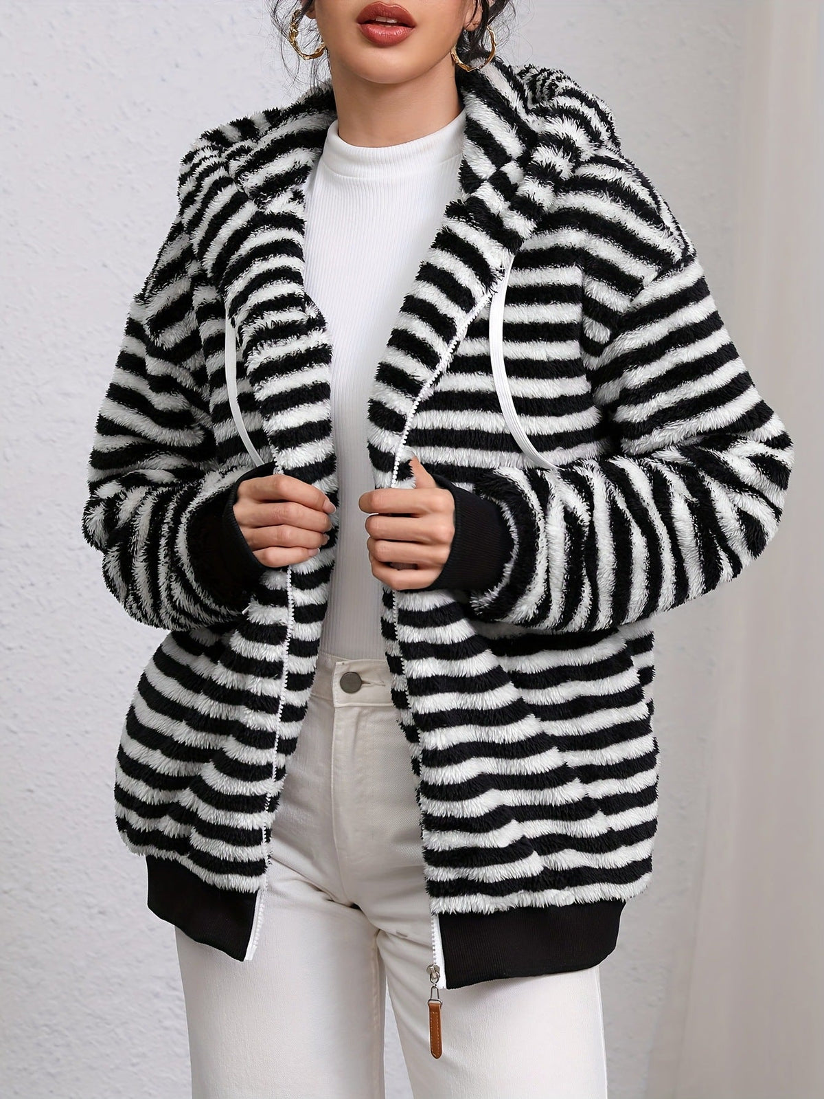 Striped plush hooded jacket in black and white, zip front, side pockets