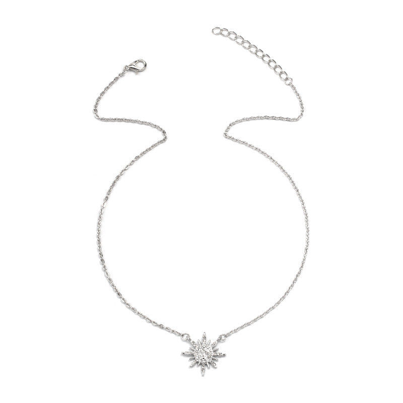 Silver sunburst choker necklace with small rhinestone pendant and adjustable clasp