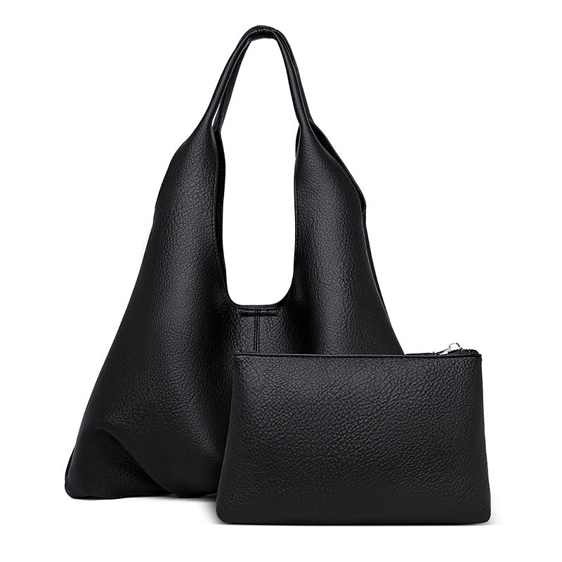 Black soft leather shoulder tote bag with open top and matching pouch