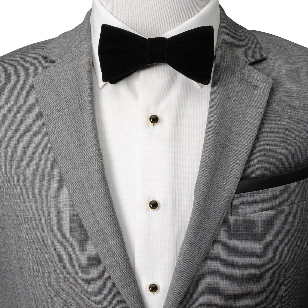 Black onyx shirt studs on white dress shirt with black bow tie