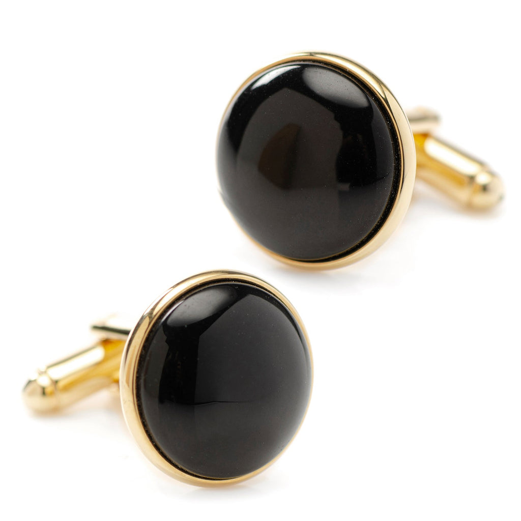 Gold-tone round cufflinks with glossy black onyx, close-up