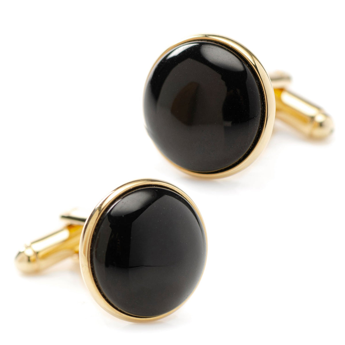 Gold-tone round cufflinks with glossy black onyx, close-up