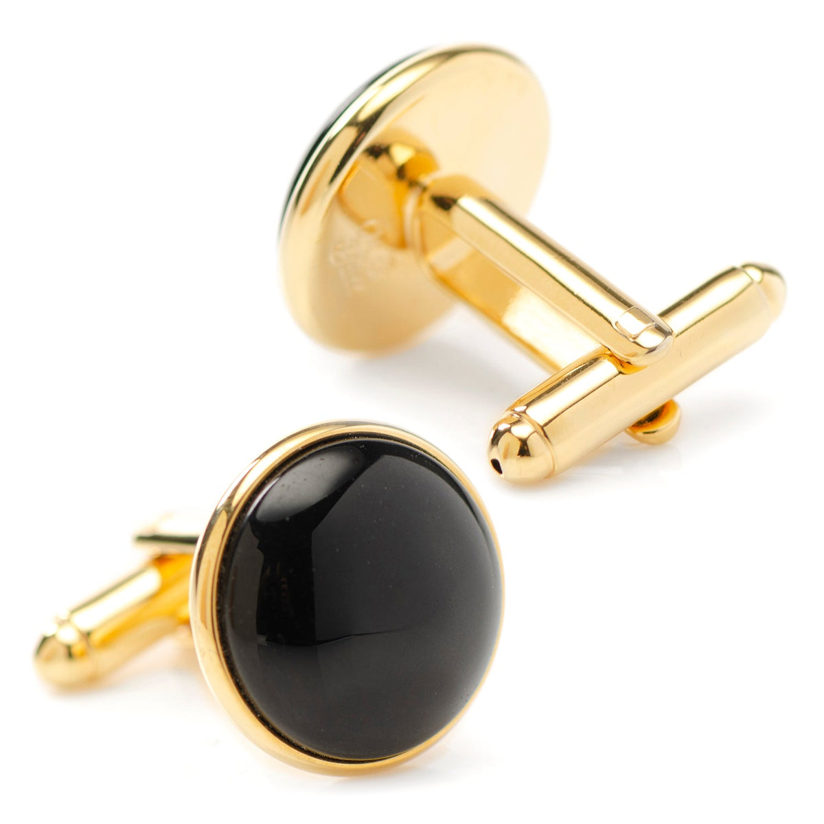 Gold-tone cufflinks with black onyx round faces, angled view