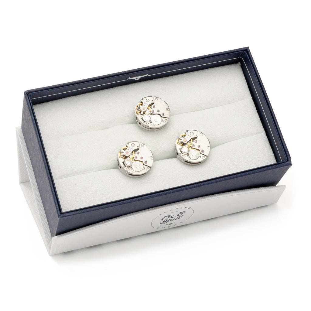 Watch-movement cufflinks in a navy presentation box, silver-tone gear faces