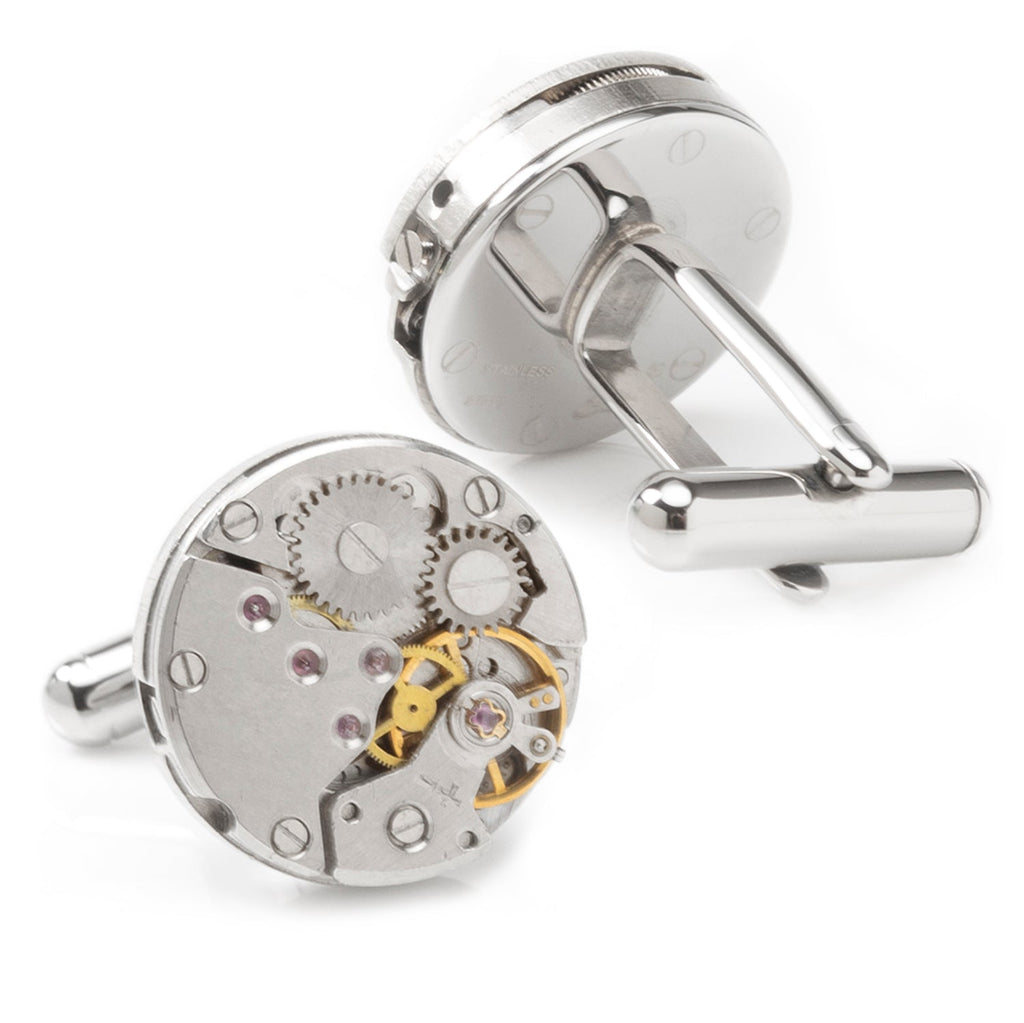 Pair of silvertone skeleton watch movement cufflinks, round dials with gold accents