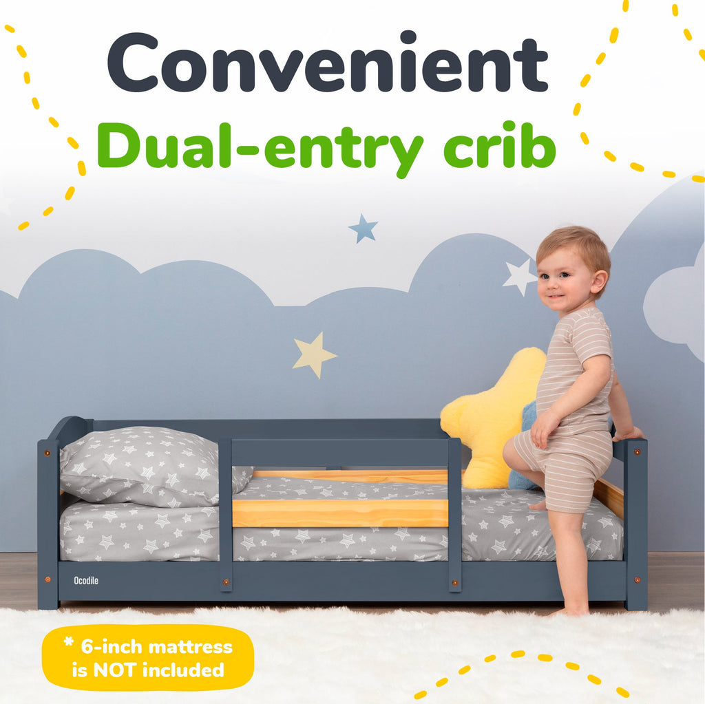 Toddler floor bed with safety rails, dark gray frame and gray star bedding