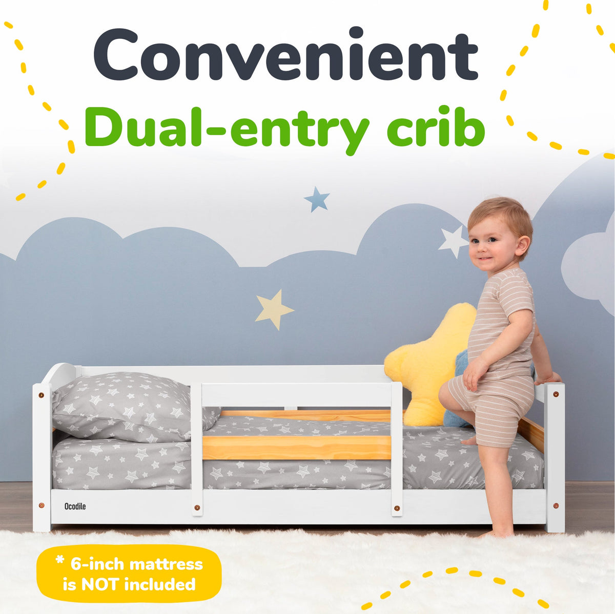 Toddler floor bed with safety rails, white frame and gray star bedding