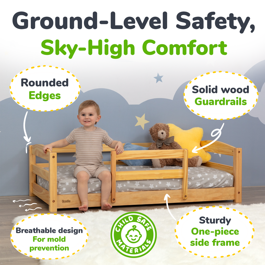 Toddler floor bed with safety rails, light wood frame and gray star mattress