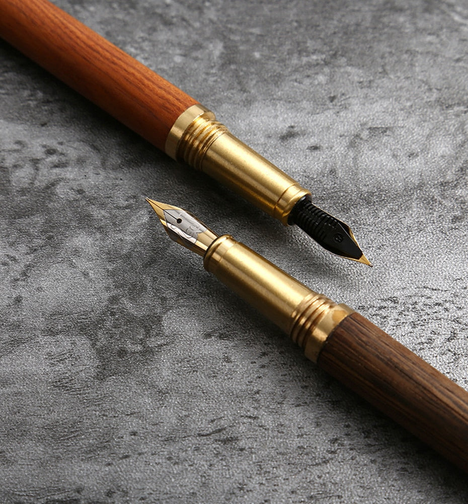 Wood fountain pen with gold trim and fine-point nib