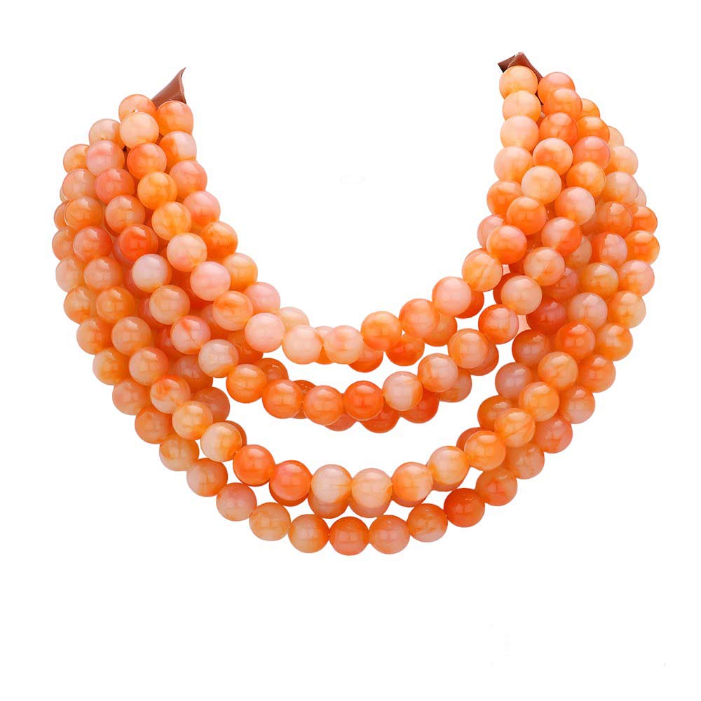 Coral orange multi-strand beaded statement necklace with layered round beads.