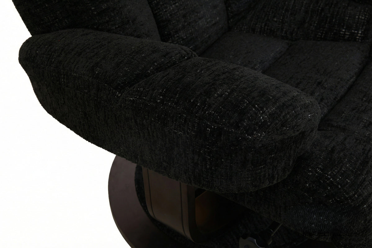 Close-up of dark upholstered recliner arm and seat padding