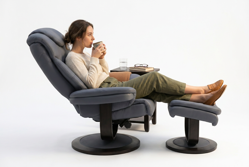 Blue-gray swivel recliner with ottoman extended, cushioned armrests and headrest.